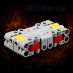 Modèle de panneau électrique fabriqué avec des blocs LEGO, illustrant un circuit électrique simple pour l'apprentissage scientifique et la décoration thématique.