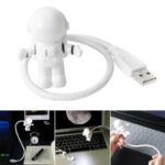 Petite figurine d'astronaute USB en décoration de science, idéale pour les amateurs de l'espace et de gadgets originaux, à utiliser comme accessoire de bureau ou décoration.