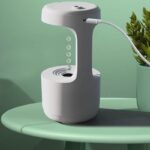 Distributeur d'eau innovant avec design épuré, idéal pour expériences scientifiques ou usage éducatif, connecté pour une utilisation pratique et hygiénique.