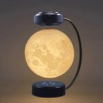 Lampe de table en forme de lune avec éclairage doux, design moderne et élégant, idéale pour la décoration intérieure ou comme veilleuse pour une ambiance chaleureuse.