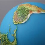 ModÚle de globe terrestre en relief illustrant la topographie de la région, avec des couleurs pour différencier les montagnes, les plaines et les zones cÎtiÚres.