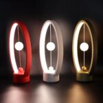 Lampe LED décorative inspirée d'un oscillateur harmonique, idéale pour la décoration scientifique ou moderne.