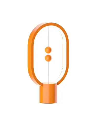 Lampe de bureau moderne en forme d'ovale orange avec deux boutons au centre, idéale pour la décoration scientifique ou moderne.