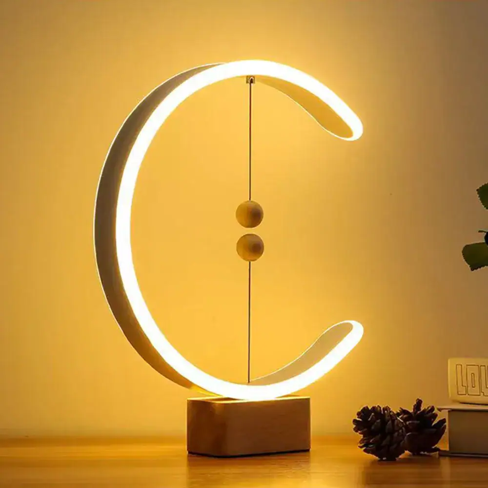 Lampe décorative en forme de croissant avec éclairage LED chaud, idéale pour une ambiance cosy et moderne.