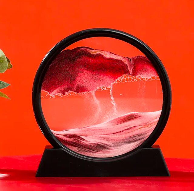 Vortex de liquide coloré dans un cadre en verre, créant un effet visuel hypnotique avec des nuances de rouge, rose et blanc. Parfait pour la décoration scientifique moderne.