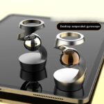 Support gyroscope suspendu pour bureau avec boule en verre et structure en métal, idéal pour la décoration scientifique ou comme objet de bureau original.