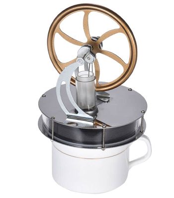 Presse à vapeur de laboratoire en métal et verre, utilisée pour des expériences scientifiques, avec un grand volant en bronze et un récipient en tasse blanche.
