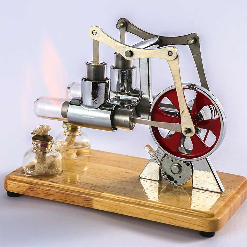 Modèle réduit de moteur à vapeur en bois et métal avec engrenages et cylindre, posé sur une base en bois, illustrant une expérience scientifique vintage.