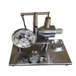 Dispositif scientifique en métal avec cadran, tubes et mécanismes pour expériences de physique ou chimie.