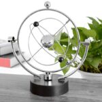 Modèle d'atome de Bohr en métal avec électrons orbitant autour du noyau, idéal pour la décoration scientifique ou éducative.