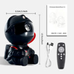 Petit vaisseau spatial en peluche noir avec casque, télécommande et câble USB, idéal pour décoration ou jouet éducatif pour enfants passionnés d'espace.