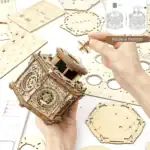 Boîte en bois à monter pour modèle scientifique, avec instructions illustrées, idéale pour les amateurs de bricolage et de décoration scientifique. Facile à assembler grâce à ses pièces pré.