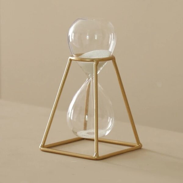 Porte-temps en verre avec cadre doré, décoration scientifique élégante et moderne, idéale pour les amateurs de design industriel et d'objets de décoration inspirés de la science.