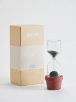 Poussoir de sable avec pot en terre cuite, objet scientifique pour expériences de physique ou décoration, présenté avec son emballage en carton.