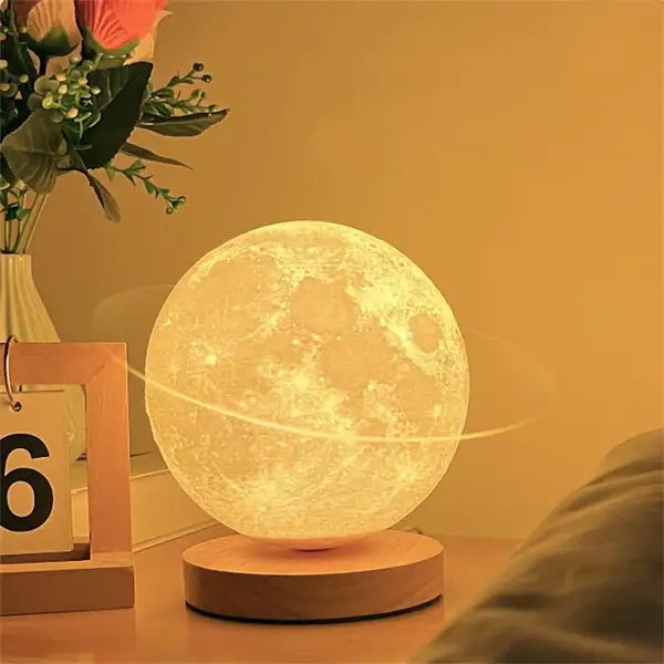 Lampe de lune décorative lumineuse pour intérieur, ambiance chaleureuse et apaisante.