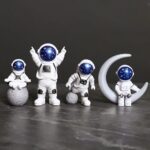 Vêtements de figurines astronautes en céramique, décoration spatiale pour la maison ou le bureau, avec des détails réalistes et un design moderne.