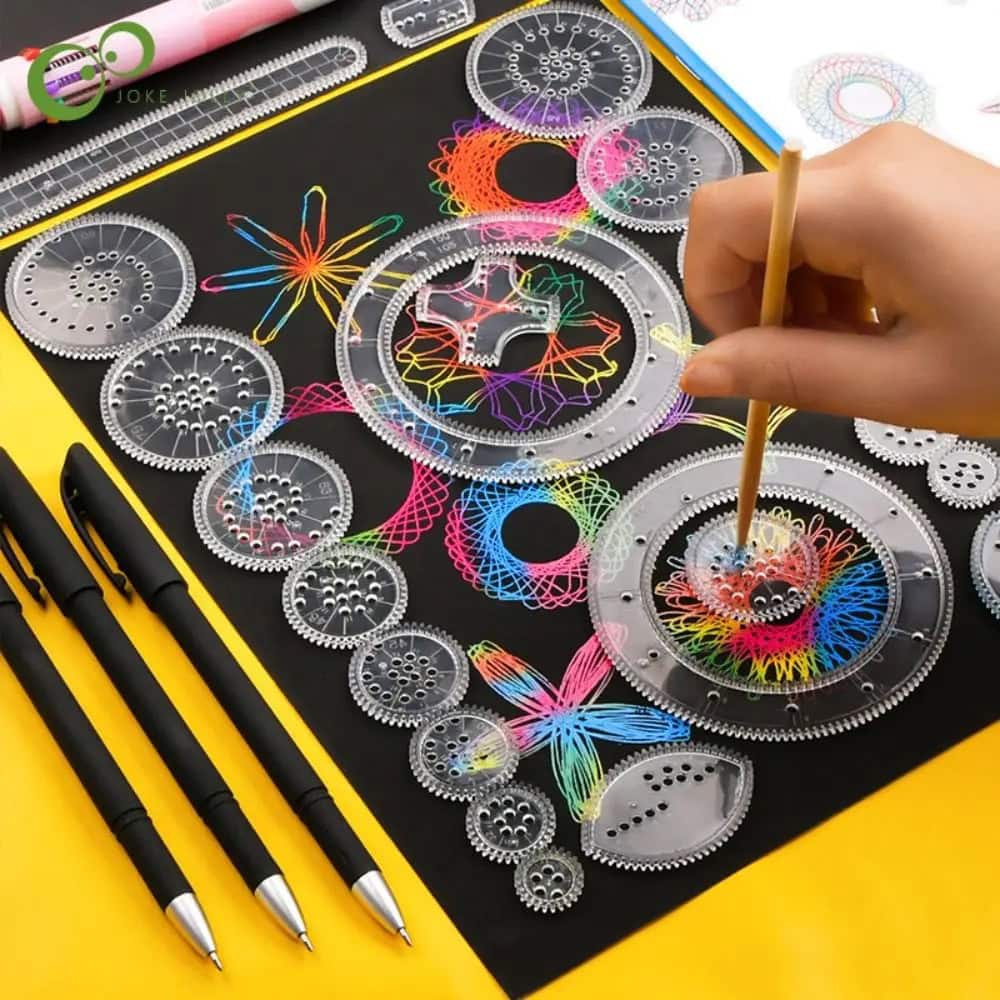 Fusées de fil de couleur multicolores avec outils de création scientifique, tels que des stylos et des cercles de tracé, sur un fond noir. Idéal pour activités éducatives et artistiques en scien.