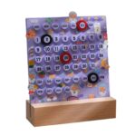 Calendrier magnétique pour enfants avec jours et dates colorés.