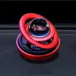 Modèle de boule à illusion optique avec spirale rouge, illustrant un objet scientifique décoratif et intrigant, parfait pour une décoration de style scientifique ou moderne.