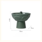 Baladez-vous dans l'univers de la science avec ce porte-bougie en céramique verte, alliant décoration et fonctionnalité pour un intérieur inspiré par la recherche scientifique.