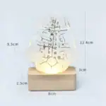 Lampe scientifique en verre avec inscriptions et base en bois, décoration originale pour espace de travail ou intérieur.
