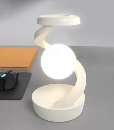 Lampe de bureau design en forme de spirale blanche avec une lumière douce, idéale pour un espace de travail ou une décoration scientifique.