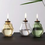 Trio de vases à bougie en verre coloré, décoration contemporaine et élégante pour intérieur ou extérieur.