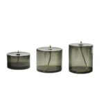 Trois bougies en verre transparent de différentes tailles, idéales pour la décoration scientifique ou moderne. Parfaites pour créer une ambiance chaleureuse et sophistiquée.