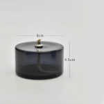 Porte-encens en verre fumé noir avec figurine de chat en or, idéal pour la décoration de votre espace. Dimensions : 8 cm de diamètre et 4,5 cm de hauteur.