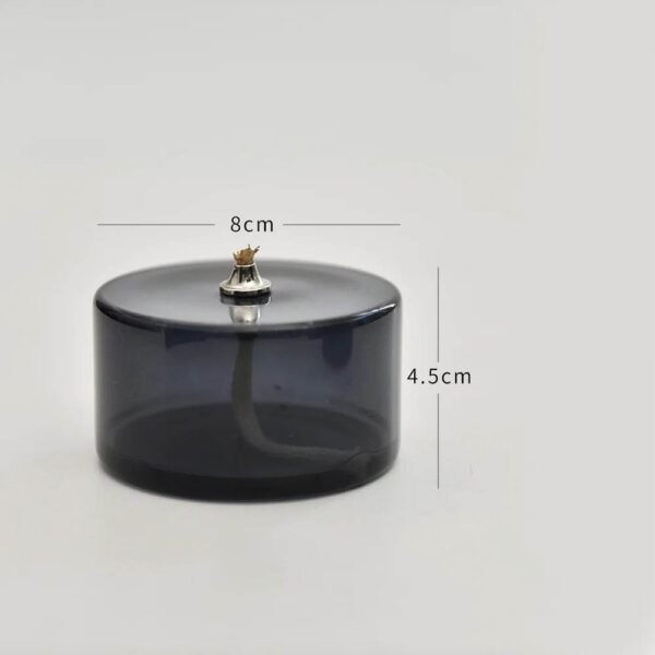 Porte-encens en verre fumé noir avec figurine de chat en or, idéal pour la décoration de votre espace. Dimensions : 8 cm de diamètre et 4,5 cm de hauteur.