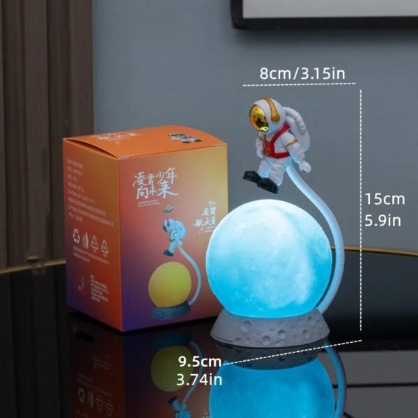 Lampe de nuit lunaire avec figurine d'astronaute pour décoration scientifique et éducative.