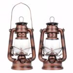 Lampe vintage en cuivre avec verre transparent, idéale pour décoration d'intérieur ou extérieur.