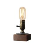 AMPoule vintage éclairage industriel en verre avec filament visible, sur socle en bois pour décoration de style industriel ou scientifique.