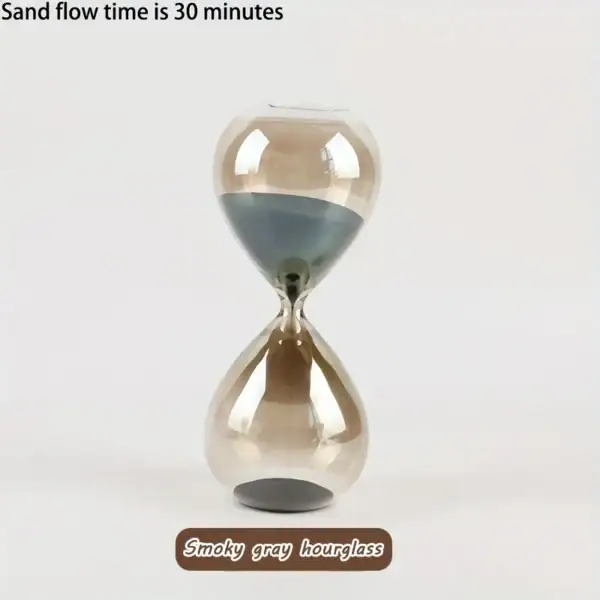 Sablier en verre avec sable gris fumé, illustrant un flux de sable de 30 minutes. Parfait pour la décoration scientifique ou comme objet de collection unique.