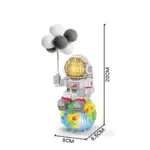 Robot en blocs LEGO avec ballons et planète Terre, décoration scientifique ludique.