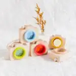 Caméra en bois avec lentilles colorées pour enfants, jouet éducatif en bois naturel, idéal pour stimuler la créativité et l'imagination des jeunes enfants.