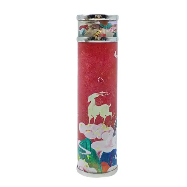 Confettis colorés dans un tube décoratif avec motif de licorne et nuages.