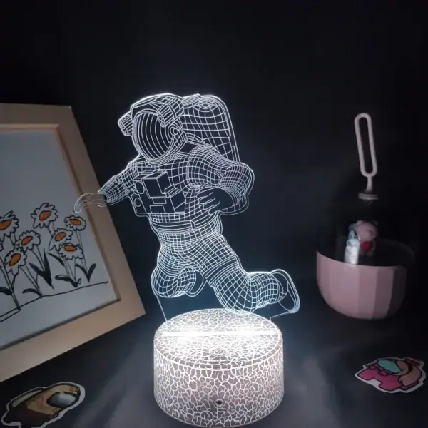 Lampe LED 3D représentant un astronaute en vol.