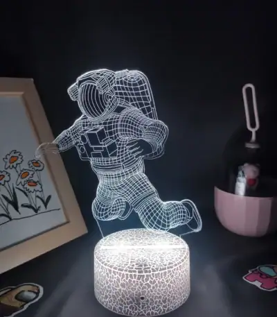 Lampe LED 3D représentant un astronaute en vol.