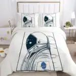 Vêtement de lit avec motif d'astronaute et planète, parfait pour une décoration de chambre à thème spatial. Confortable et design, idéal pour les amateurs d'astronomie et d'exploration spatiale.