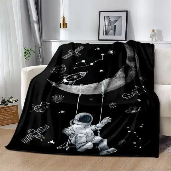 Couverture enfant avec motif spatial, astronautes, étoiles et planètes, idéale pour une décoration de chambre thématique scientifique ou spatiale.