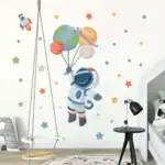 Décoration murale d'astronaute avec planètes pour chambre d'enfant, idéale pour stimuler l'imagination et l'intérêt pour l'espace.