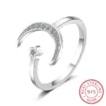 Bague en argent sterling 925 avec étoile et lune, ornée de cristaux brillants, design élégant et moderne, idéale pour les amateurs de bijoux inspirés de l'astronomie.