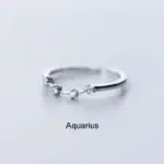 Anneau Aquarius avec diamants, symbole astrologique, bijou élégant pour amateurs de science et décoration.