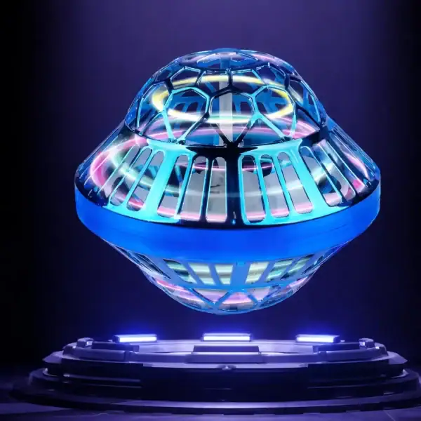 Modèle de vaisseau spatial en verre avec éclairage LED multicolore, exposé sur un socle noir, illustrant un objet scientifique décoratif et futuriste.