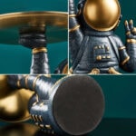Figurine d'astronaute en métal noir et or, décorative, inspirée de l'espace, idéale pour la décoration intérieure ou comme objet de collection scientifique.