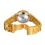 Montre mécanique dorée avec bracelet en acier, vue arrière.