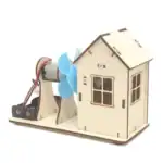 Mini maison en bois avec moteur électrique et hélice bleue, idéale pour expériences scientifiques et projets éducatifs.