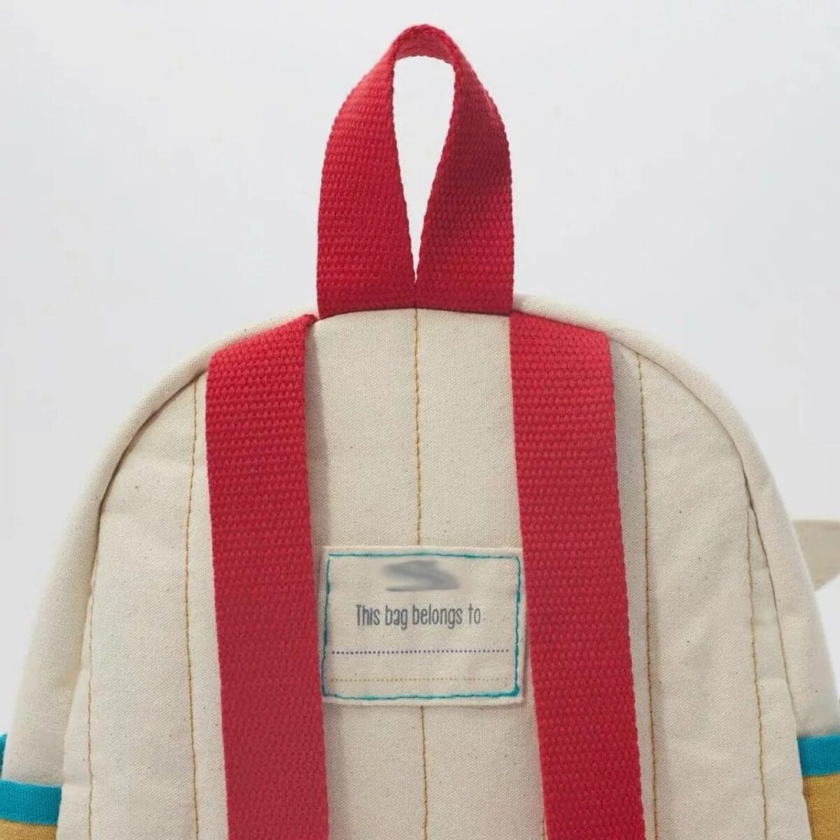 Étiquette personnalisable sur un sac à dos scientifique, parfait pour étudiants ou passionnés de sciences, avec un design pratique et coloré.