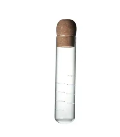 Pipette en verre avec bouchon en liège, utilisée pour des expériences scientifiques ou comme objet de décoration scientifique.